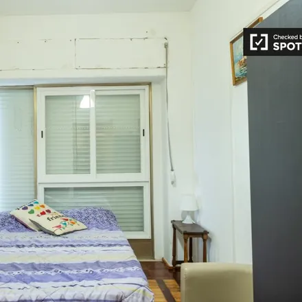 Rent this 6 bed room on Rua Pedro Nunes 9 in 1050-170 Lisbon, Portugal