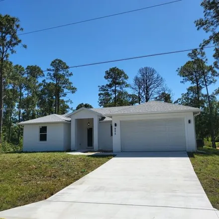 Rent this 3 bed house on 828 McArthur Avenue in Lehigh Acres, FL 33936