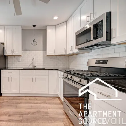Rent this 3 bed apartment on 1957 W Belmont Ave