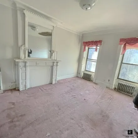Buy this 4 bed house on 262 Malcolm X Boulevard in New York, NY 10027