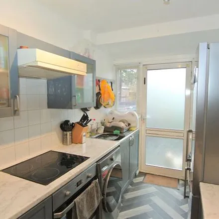Rent this 2 bed townhouse on Windsor Drive in Ashford, TW15 3JE