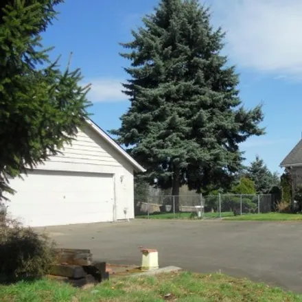 Buy this 4 bed house on Cedarcrest Middle School in 13th Avenue Court East, Spanaway