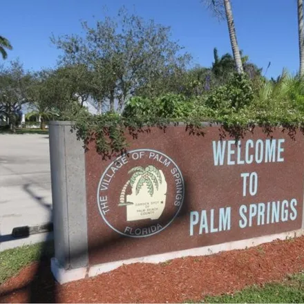 Rent this 2 bed townhouse on 161 Springdale Circle in Palm Springs, FL 33461
