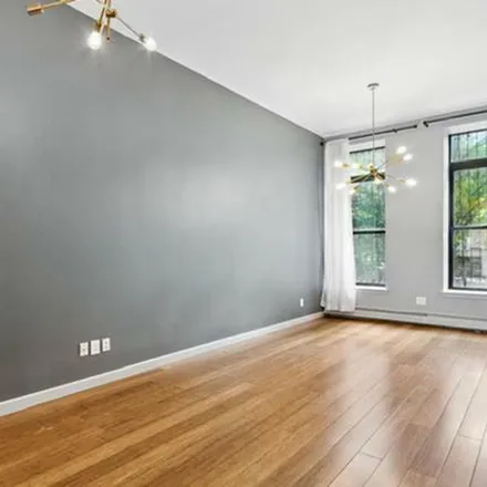 Rent this 3 bed townhouse on 51 West 131st Street in New York, NY 10037