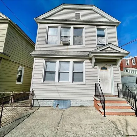 Buy this 5 bed house on 23-10 121st Street in New York, NY 11356