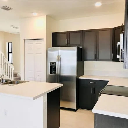 Rent this 3 bed townhouse on West 33rd Lane in Hialeah, FL 33018