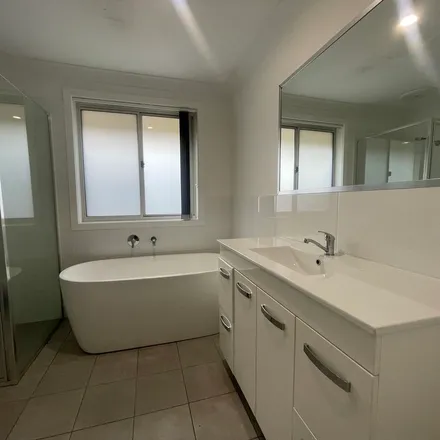 Rent this 3 bed apartment on Aubin Avenue in Thrumster NSW 2444, Australia