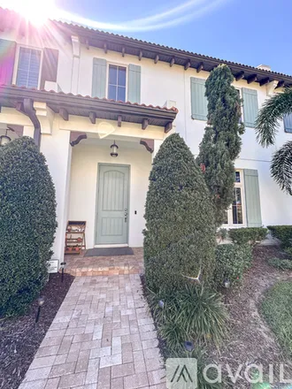 Rent this 4 bed townhouse on 8807 Fountain Palm Alley