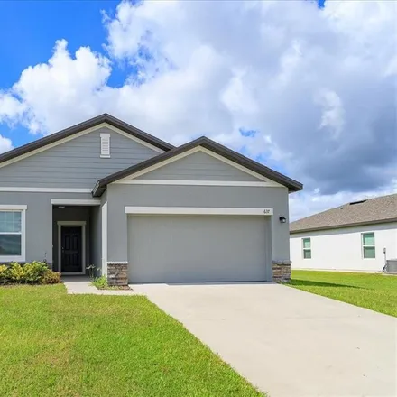 Buy this 4 bed house on Winding Blossom Drive in Groveland, FL 34736