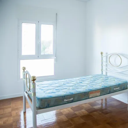Rent this 4 bed room on Avenida de Berlim 83 in 1800-111 Lisbon, Portugal