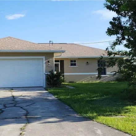 Rent this 3 bed house on 1225 Ermine Street in Lehigh Acres, FL 33974