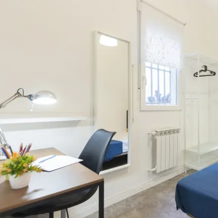 Rent this 6 bed room on Madrid in Calle Ramón Calabuig, 19