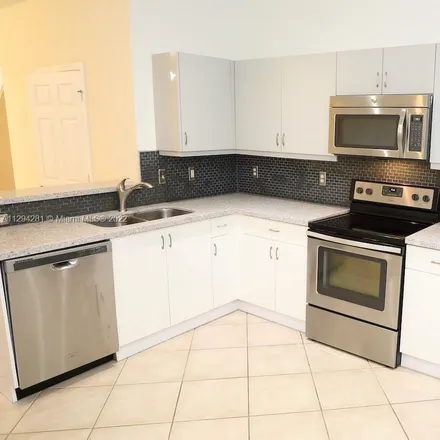 Rent this 3 bed townhouse on 3899 Tree Top Drive in Weston, FL 33332