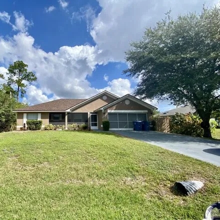 Rent this 3 bed house on 2425 Palisades Drive Southeast in Palm Bay, FL 32909