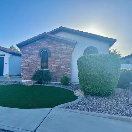 Rent this 4 bed house on 3400 South Holguin Way in Chandler, AZ 85248