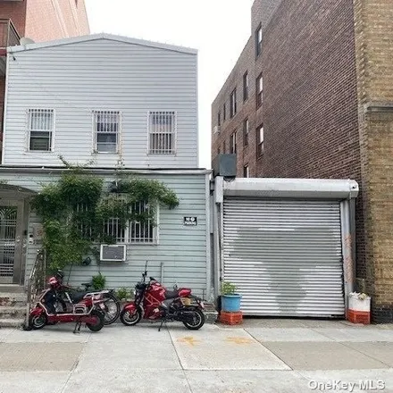 Buy this 6 bed townhouse on 37-61 61st Street in New York, NY 11377