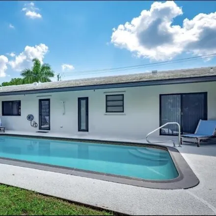 Rent this 3 bed house on 5942 Northeast 7th Avenue in Bel Marra, Boca Raton