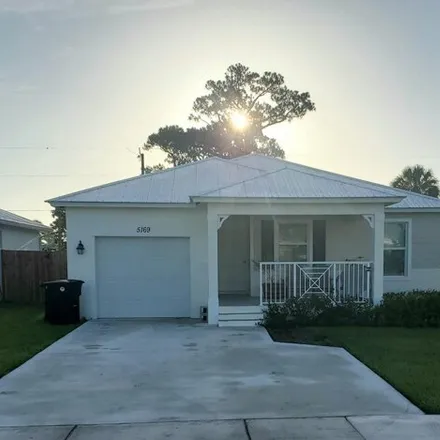 Rent this 3 bed house on Southeast Milissa Court in Port Salerno, FL 34997