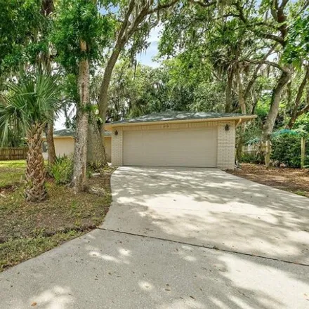 Buy this 3 bed house on 3410 Mango Tree Dr in Edgewater, Florida