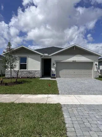 Rent this 4 bed house on Southwest Commerce Centre Drive in Port Saint Lucie, FL 34986