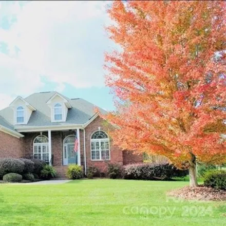 Buy this 4 bed house on 6143 Four Wood Drive in Matthews, NC 28014