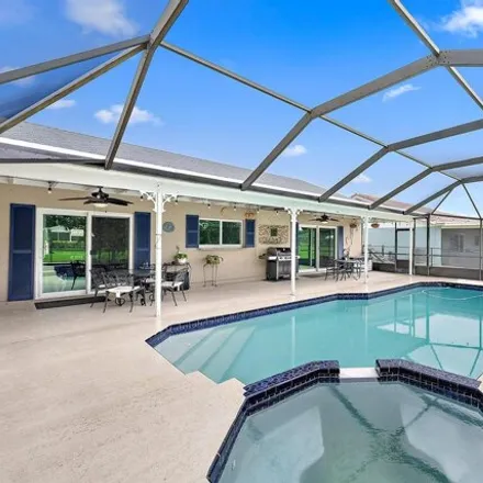 Buy this 4 bed house on 11544 Sanderling Dr in Wellington, Florida