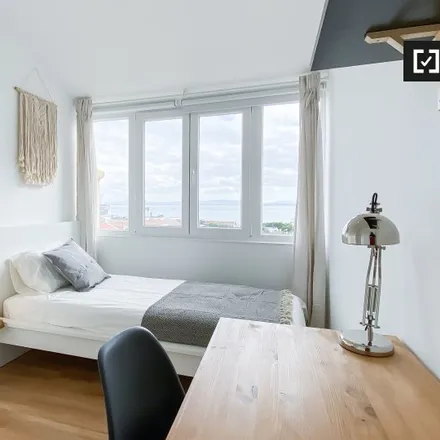 Rent this 7 bed room on Avenida Dom Carlos I 122 in 1200-651 Lisbon, Portugal