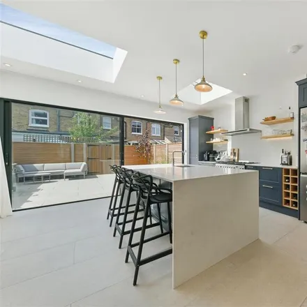 Rent this 4 bed house on Kirkley Road in London, SW19 3AY