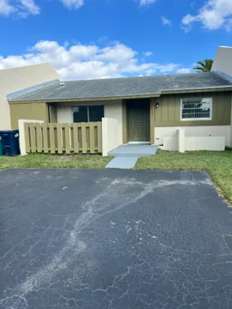 Rent this 2 bed townhouse on 11013 SW 125 Ave