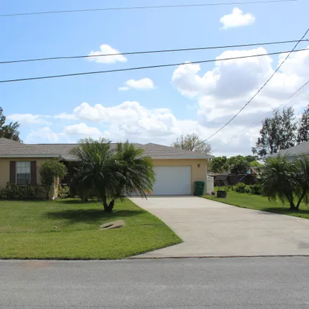 Buy this 4 bed house on 6599 Donlon Road in Lakewood Park, FL 34951