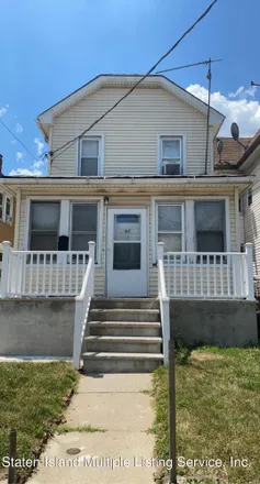 Buy this 3 bed house on 92 Lockman Avenue in New York, NY 10303