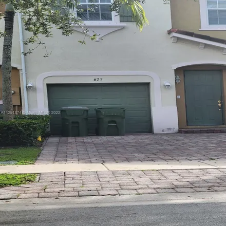 Rent this 4 bed townhouse on 677 Northeast 21st Terrace in Homestead, FL 33033