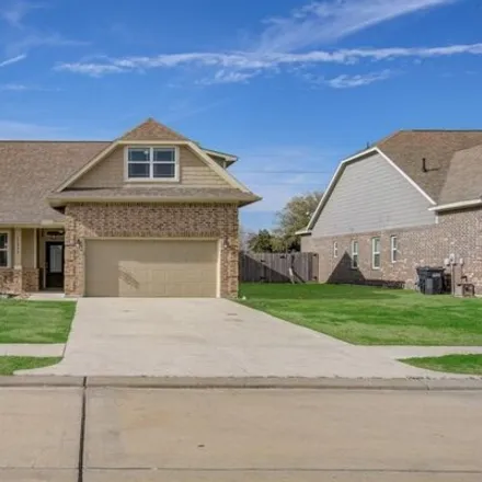 Buy this 3 bed house on Champions Gate Drive in Mont Belvieu, TX
