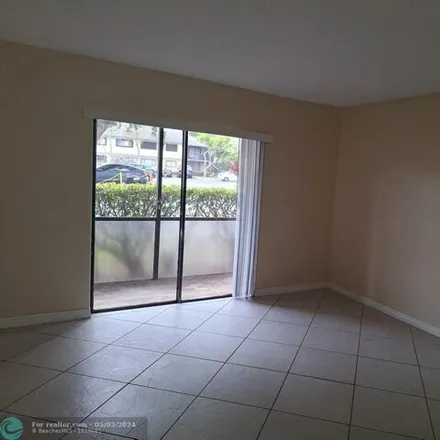 Rent this 2 bed condo on 669 Trace Circle in Arlington Park, Deerfield Beach
