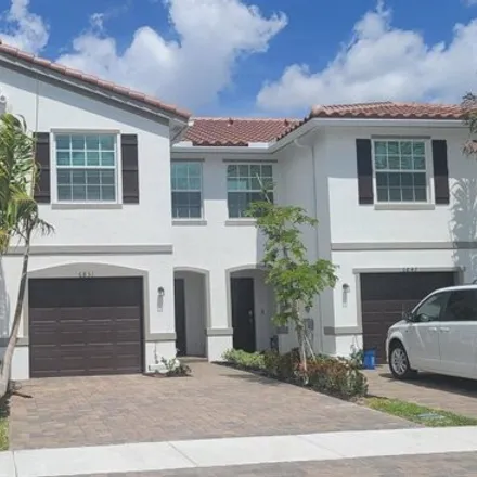 Rent this 3 bed townhouse on unnamed road in Poincianna Place, Palm Beach County