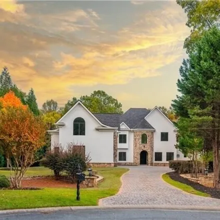 Buy this 7 bed house on 598 Covington Cove in Johns Creek, GA 30022