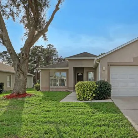 Buy this 3 bed house on 2118 Spring Creek Circle Northeast in Palm Bay, FL 32905