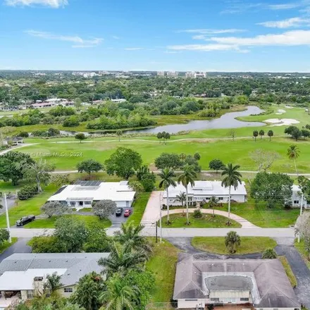 Buy this 6 bed house on Plantation Preserve Golf Course & Club in 7050 West Broward Boulevard, Plantation