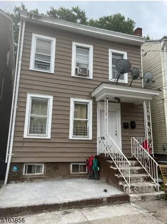 Buy this 5 bed townhouse on 245 North 4th Street in Paterson, NJ 07522