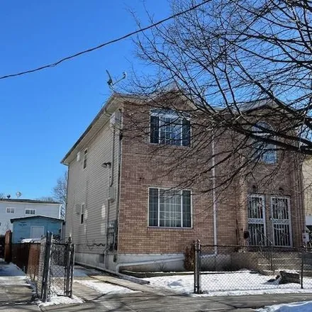 Buy this 6 bed house on 119-23 165th Street in New York, NY 11434
