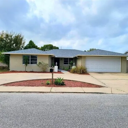 Rent this 3 bed house on 7130 Cay Drive in Jasmine Estates, FL 34668