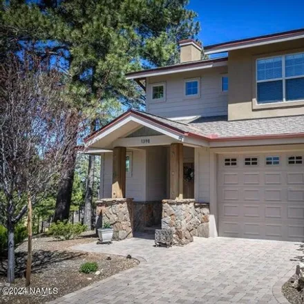 Buy this 2 bed townhouse on 1398 East Sundrop Lane in Flagstaff, AZ 86001