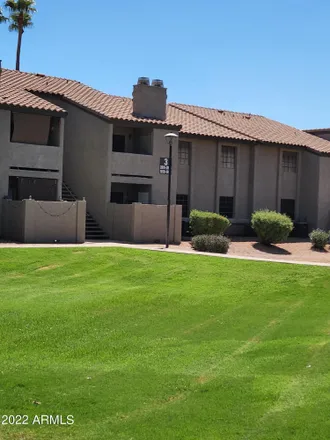 Buy this 2 bed townhouse on Woodglen Square 2 Condominiums in 533 West Guadalupe Road, Mesa