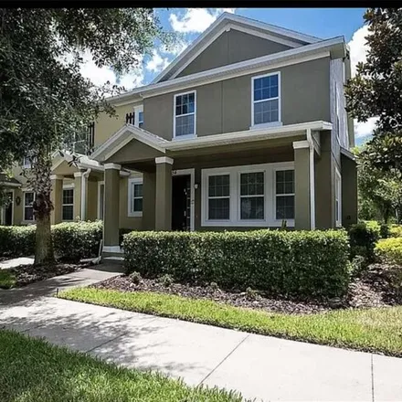 Rent this 4 bed townhouse on Canary Yellow Lane in Orlando, FL 32827