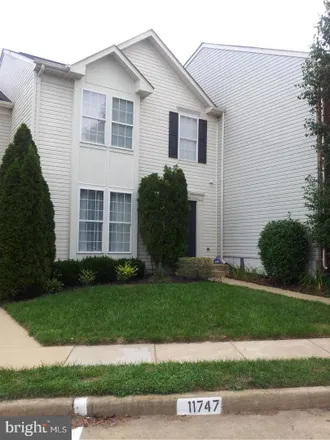 Rent this 4 bed townhouse on 11749 Batley Place in Lake Ridge, VA 22192
