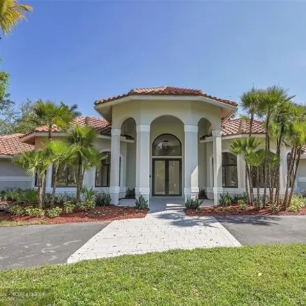 Buy this 5 bed house on 7685 Northwest 47th Drive in Whispering Woods, Coral Springs