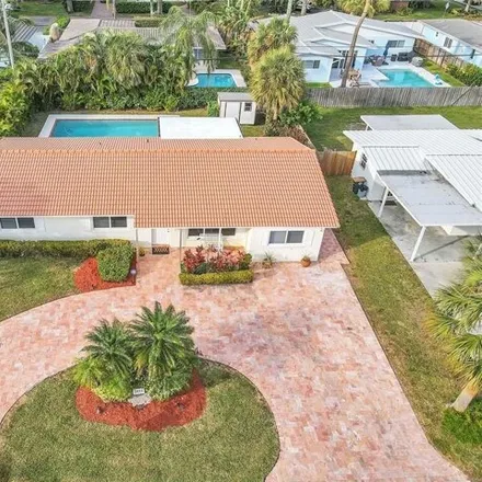 Buy this 4 bed house on 2033 Northeast 34th Street in Lighthouse Point, FL 33064