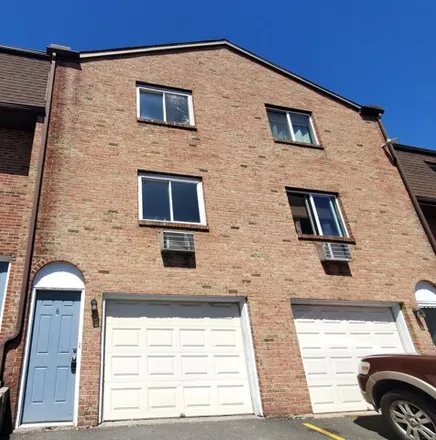 Buy this 2 bed townhouse on Mountain Village Road in Waterbury, CT 06706