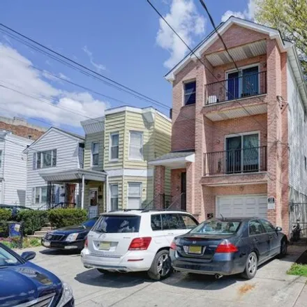 Buy this 8 bed house on 40 Olean Avenue in Jersey City, NJ 07304
