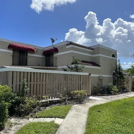 Buy this 3 bed townhouse on 3908 Village Drive in Kingsland, Delray Beach